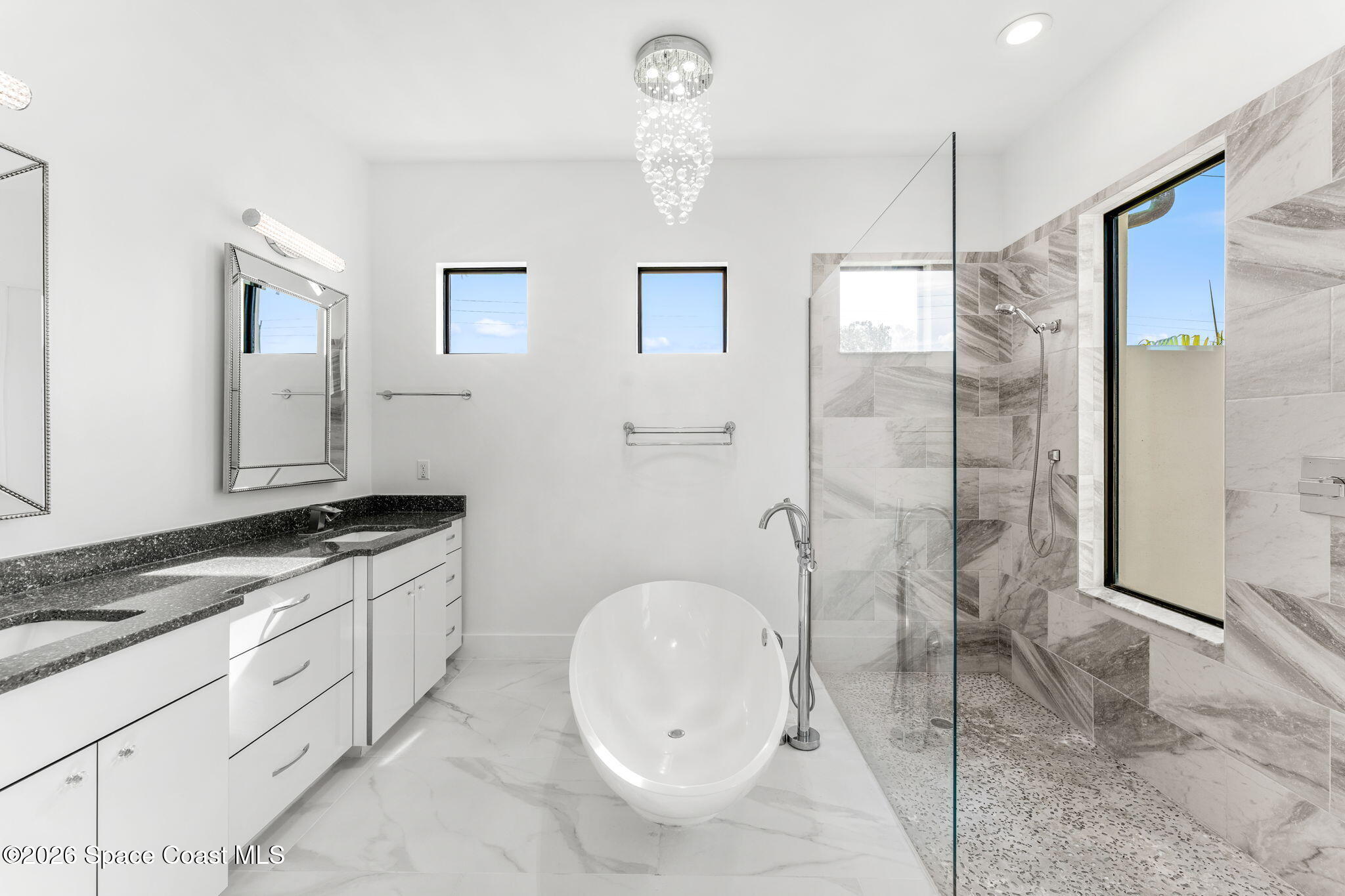 2355 North Riverside Drive Indialantic, FL 32903 - Photo 20 of 70 a bathroom with a granite countertop sink a toilet and shower