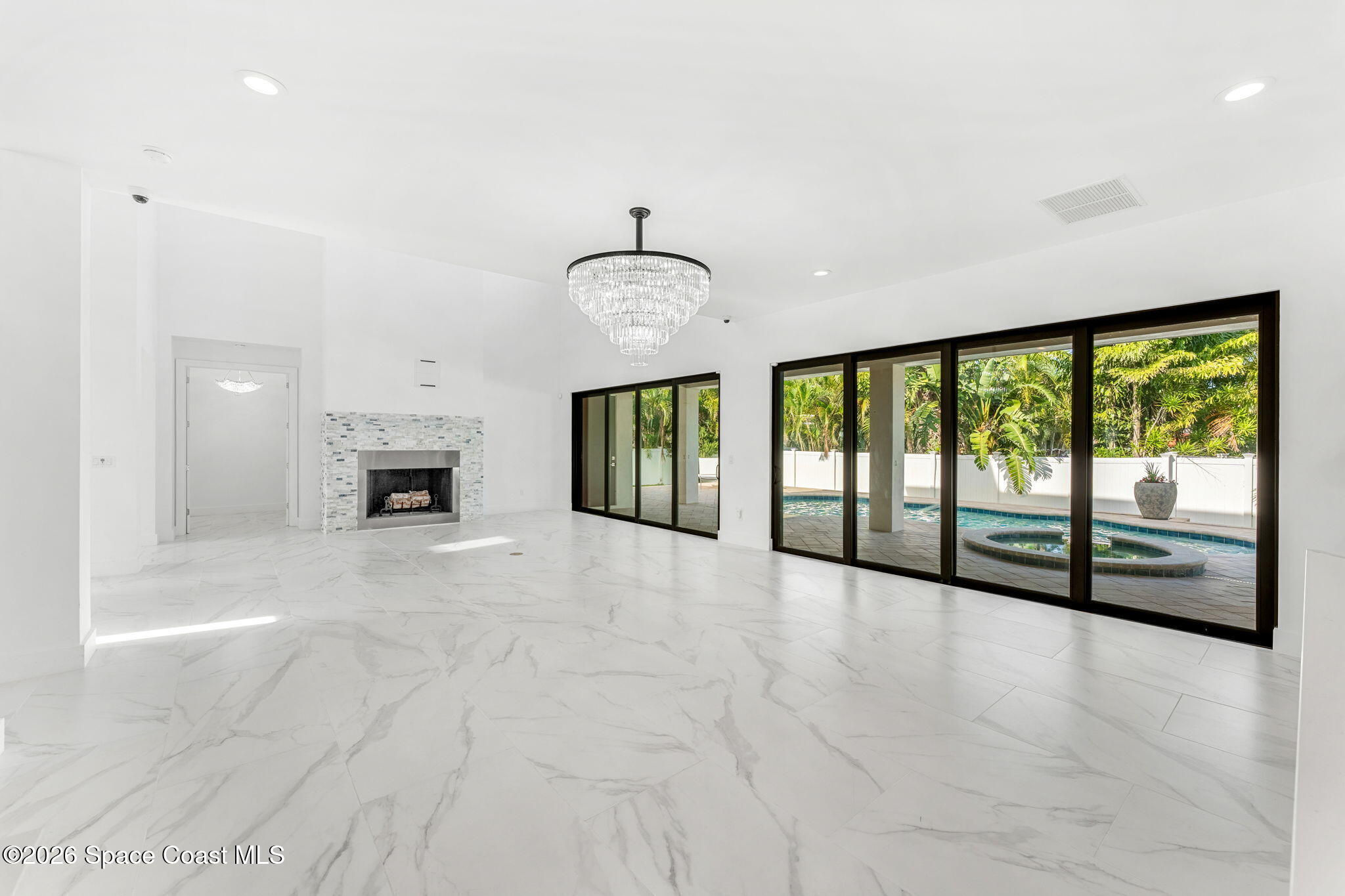 2355 North Riverside Drive Indialantic, FL 32903 - Photo 25 of 70 a view of an empty room with a fireplace and a window