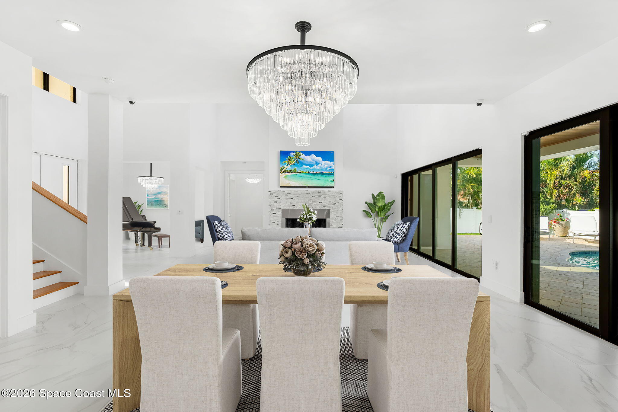 2355 North Riverside Drive Indialantic, FL 32903 - Photo 26 of 70 a living room with furniture a chandelier and a dining table