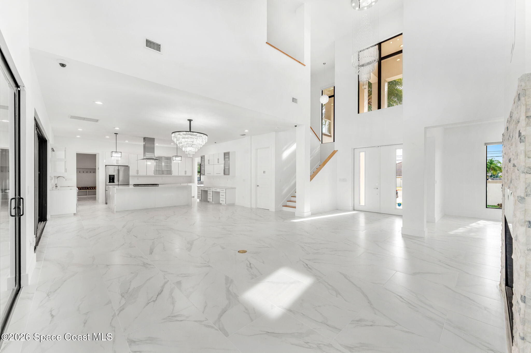 2355 North Riverside Drive Indialantic, FL 32903 - Photo 31 of 70 a view of a living room and kitchen with windows