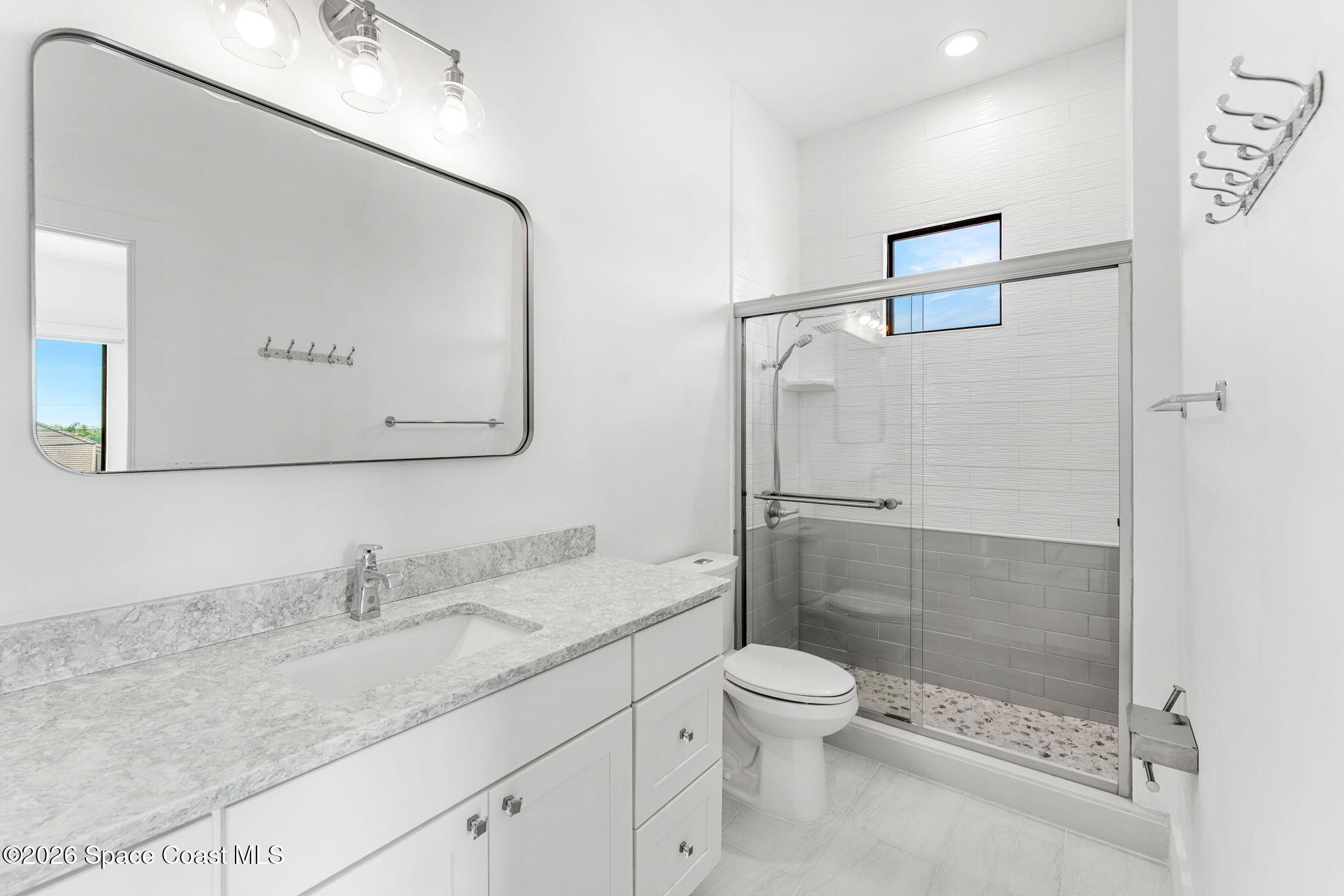 2355 North Riverside Drive Indialantic, FL 32903 - Photo 37 of 70 a bathroom with a granite countertop sink mirror shower and toilet