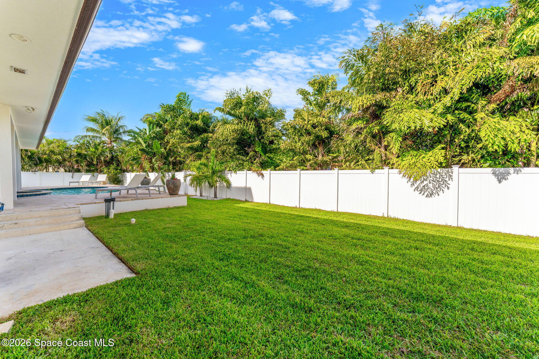 2355 North Riverside Drive Indialantic, FL 32903 - Photo 49 of 70 a view of a yard with a tree