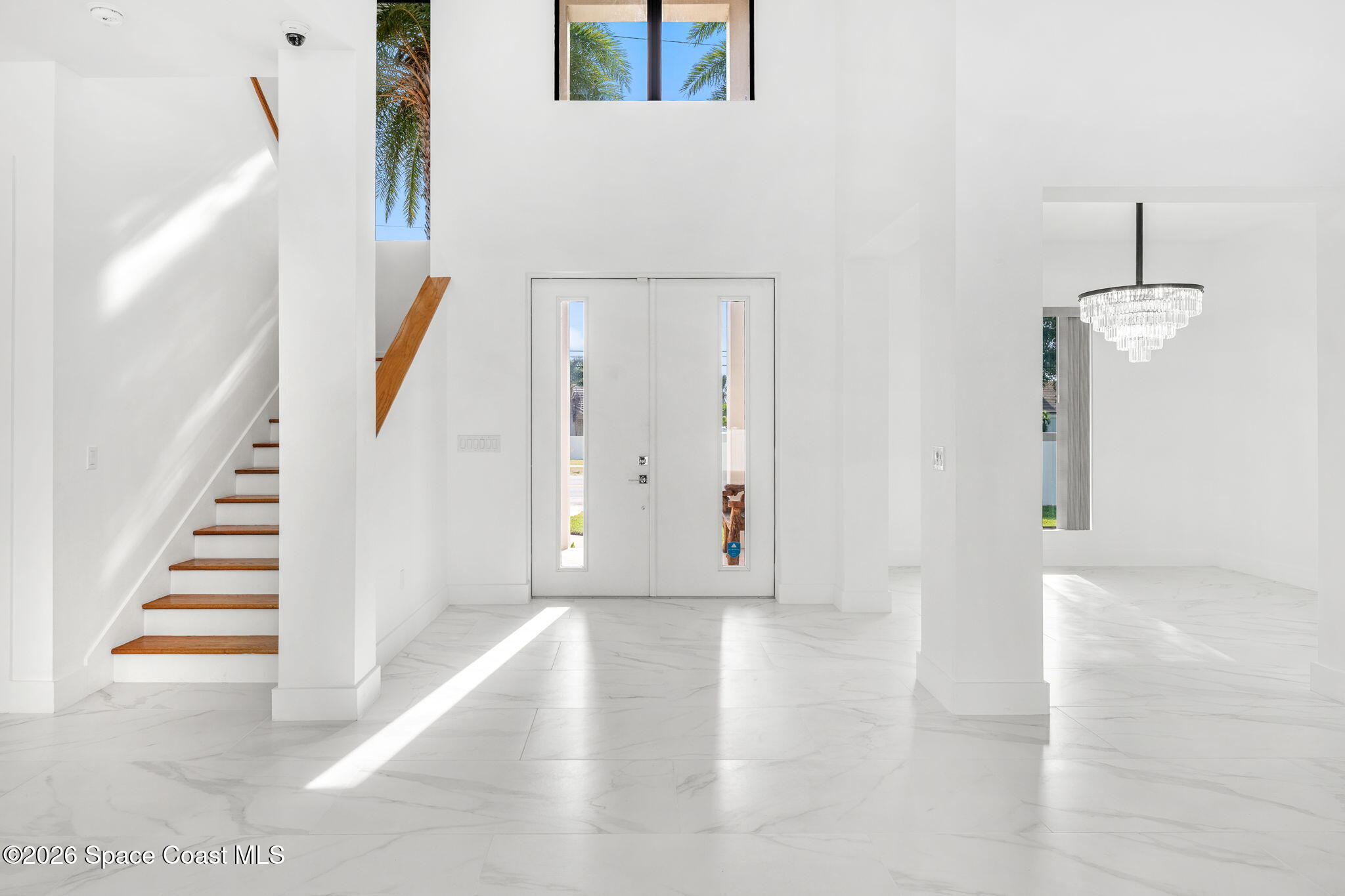 2355 North Riverside Drive Indialantic, FL 32903 - Photo 7 of 70 a view of a hallway with wooden floor and staircase