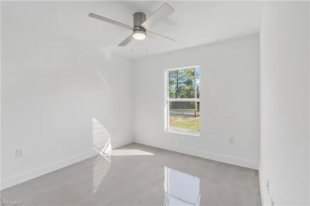 a view of a kitchen with a sink and cabinets