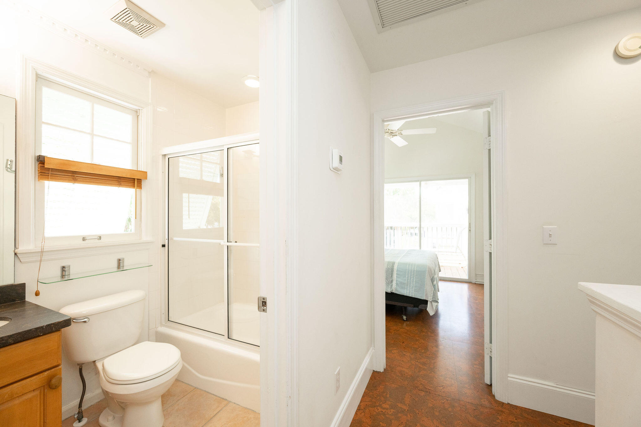 1 Spoonbill Way Key West, FL 33040 - Photo 17 of 38 a bathroom with a granite countertop toilet a sink and a mirror