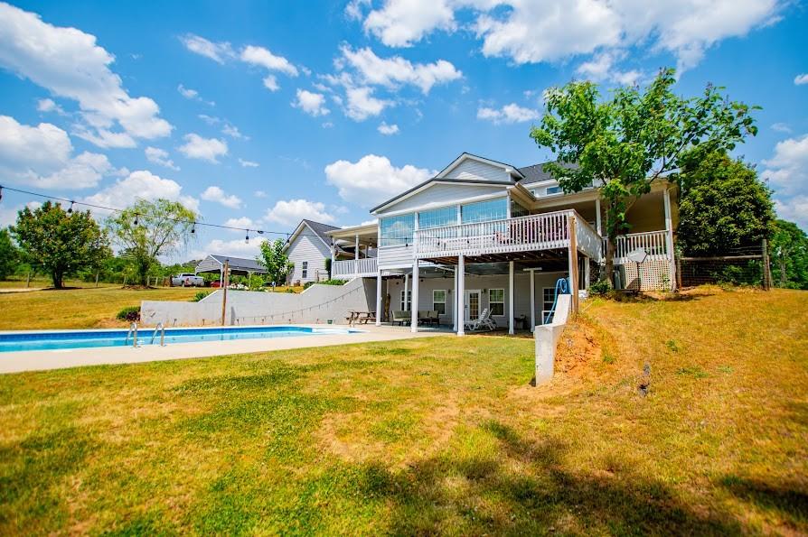 575 Liberty Church Road Carrollton, GA 30116 - Photo 72 of 95 a view of a house with a swimming pool