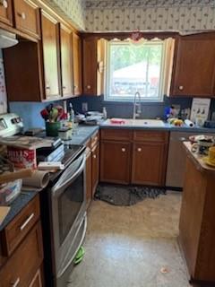 420 Post Oak Road Wills Point, TX 75169 - Photo 7 of 19 a kitchen with a sink stove and cabinets