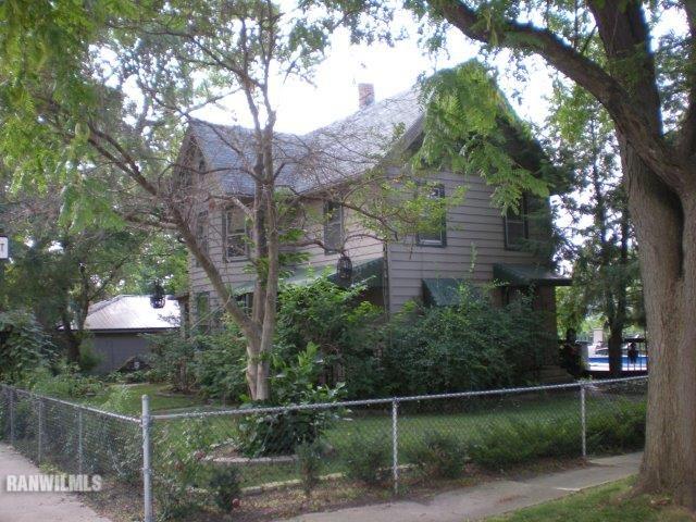 218 South Ridge Street Shannon, IL 61078 - Photo 3 of 25 a front view of a house with a garden