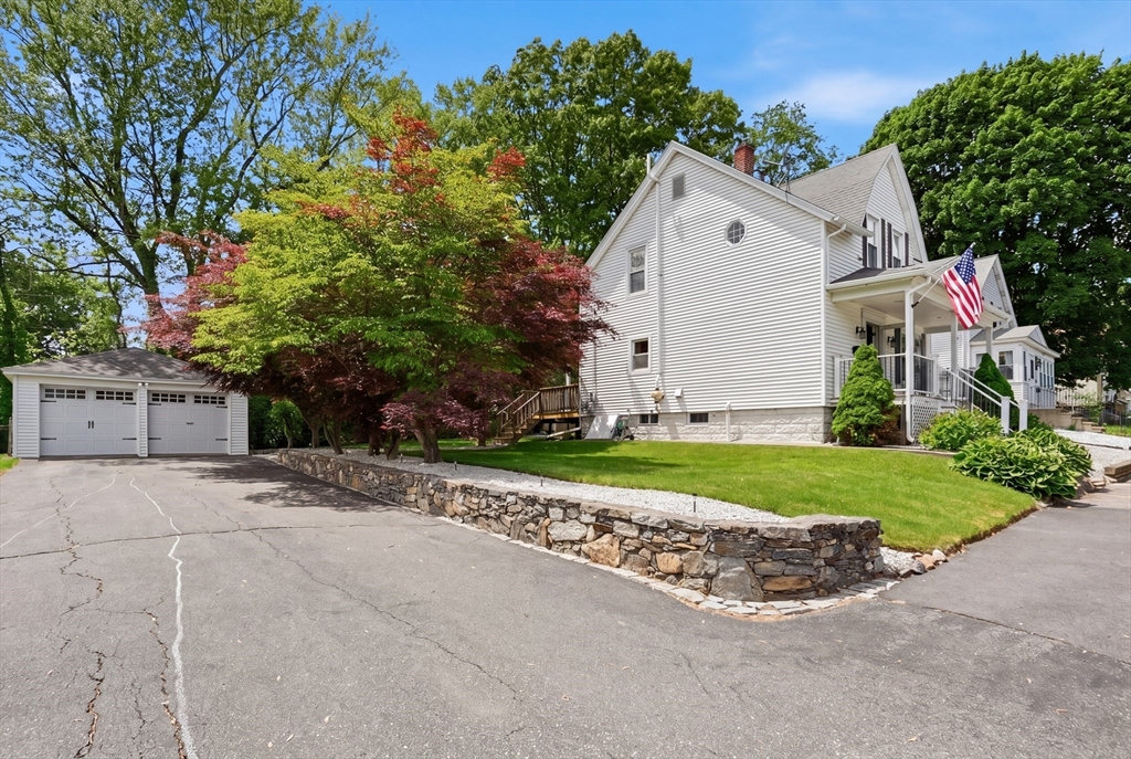 6 Anderson Avenue Worcester, MA 01604 - Photo 3 of 39 a view of a white house with a yard and large tree