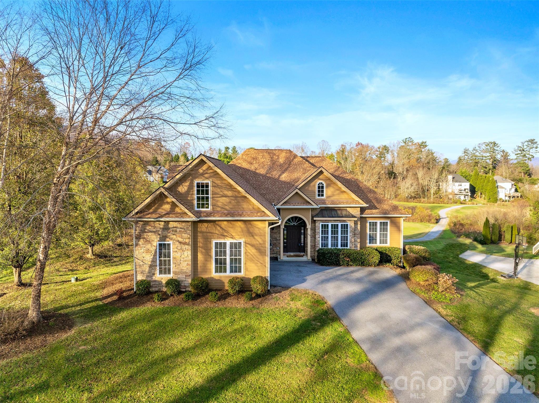 a front view of a house with a yard