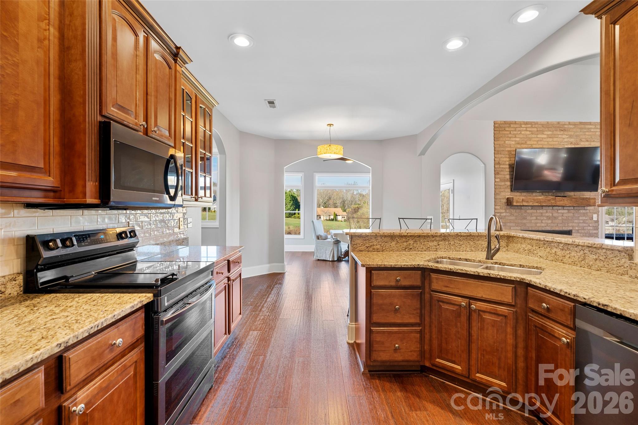 160 Fairway Falls Road Mills River, NC 28759 - Photo 19 of 43 a kitchen with a sink stove and microwave