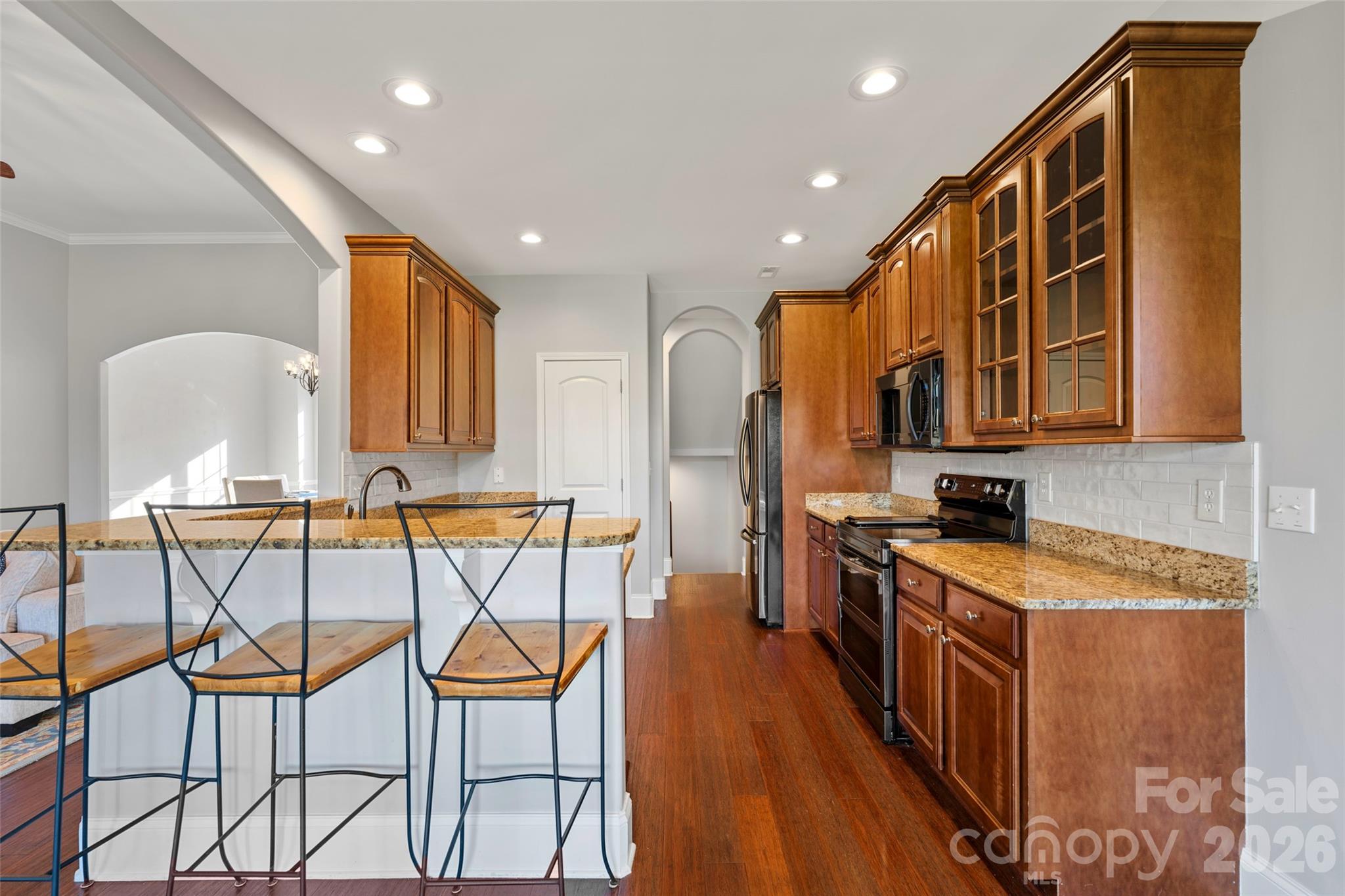 160 Fairway Falls Road Mills River, NC 28759 - Photo 20 of 43 a kitchen with a sink and chairs