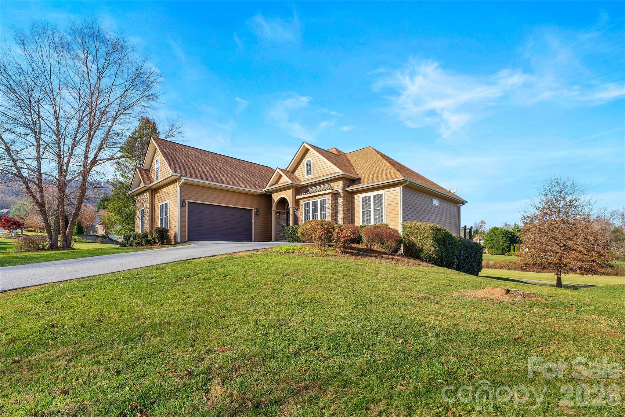 160 Fairway Falls Road Mills River, NC 28759 - Photo 2 of 43 a yard that is sitting in front of a house with a big yard