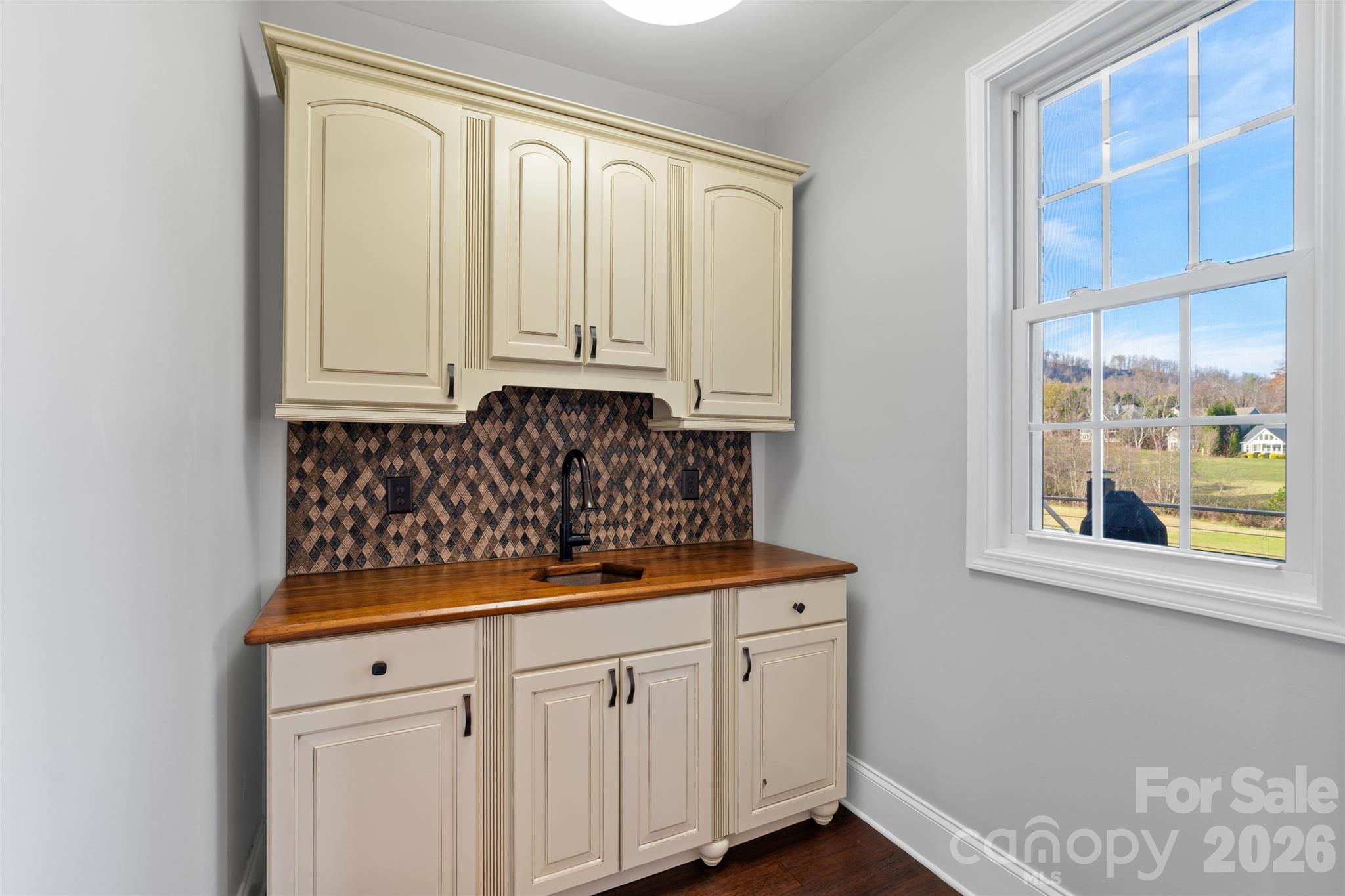 160 Fairway Falls Road Mills River, NC 28759 - Photo 21 of 43 a view of kitchen with granite countertop white cabinets and sink