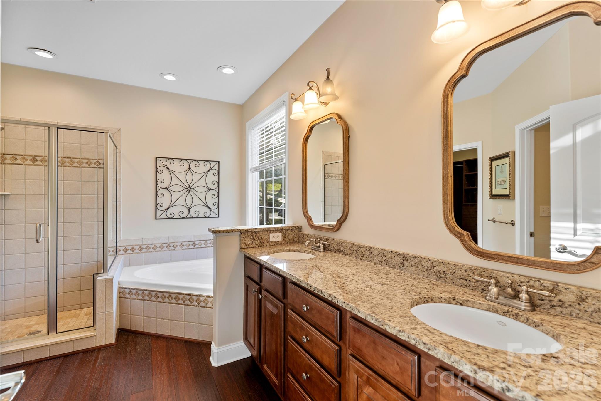 160 Fairway Falls Road Mills River, NC 28759 - Photo 23 of 43 a spacious bathroom with a granite countertop tub sink and mirror