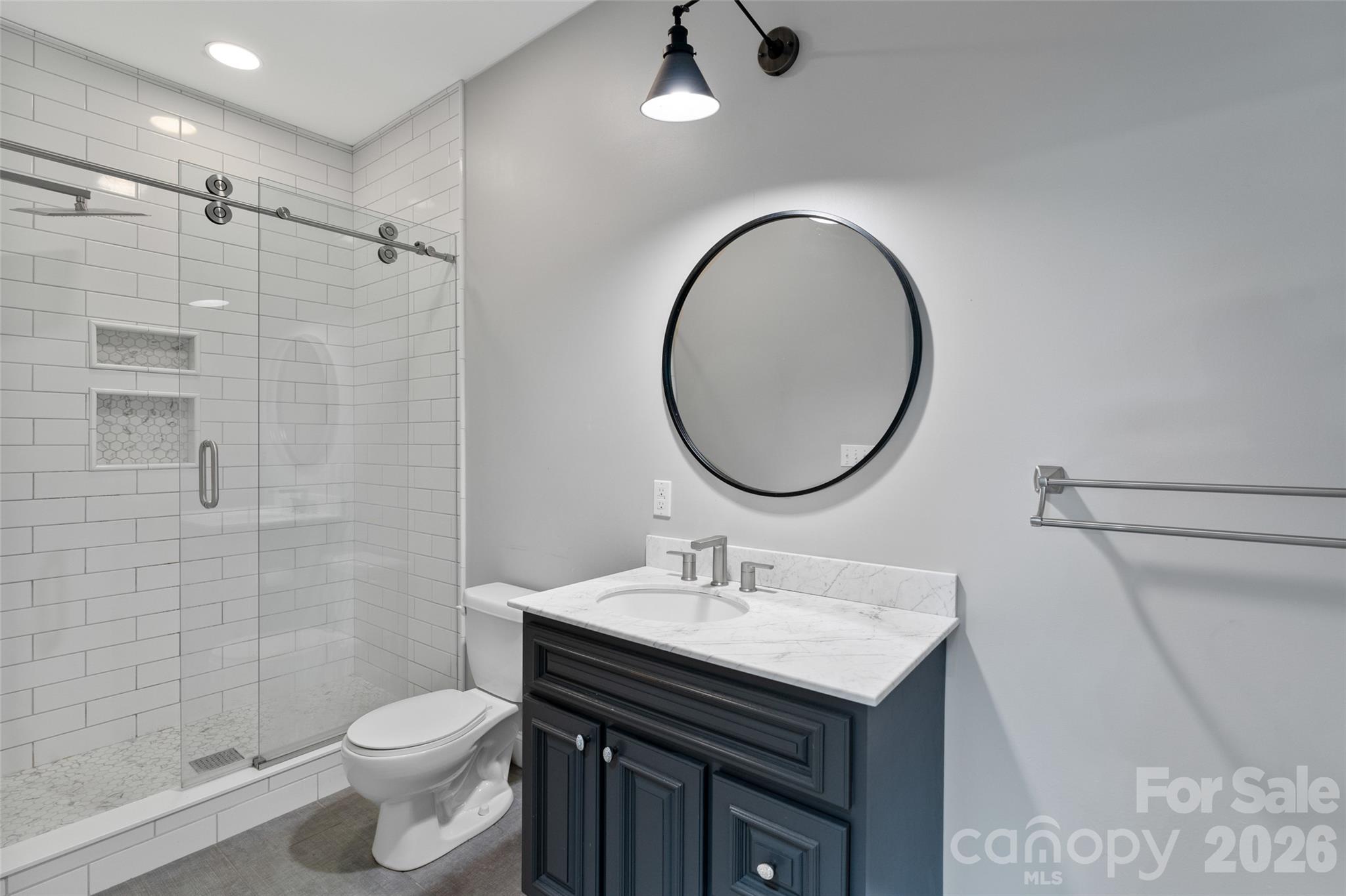 160 Fairway Falls Road Mills River, NC 28759 - Photo 35 of 43 a bathroom with a sink toilet and a mirror