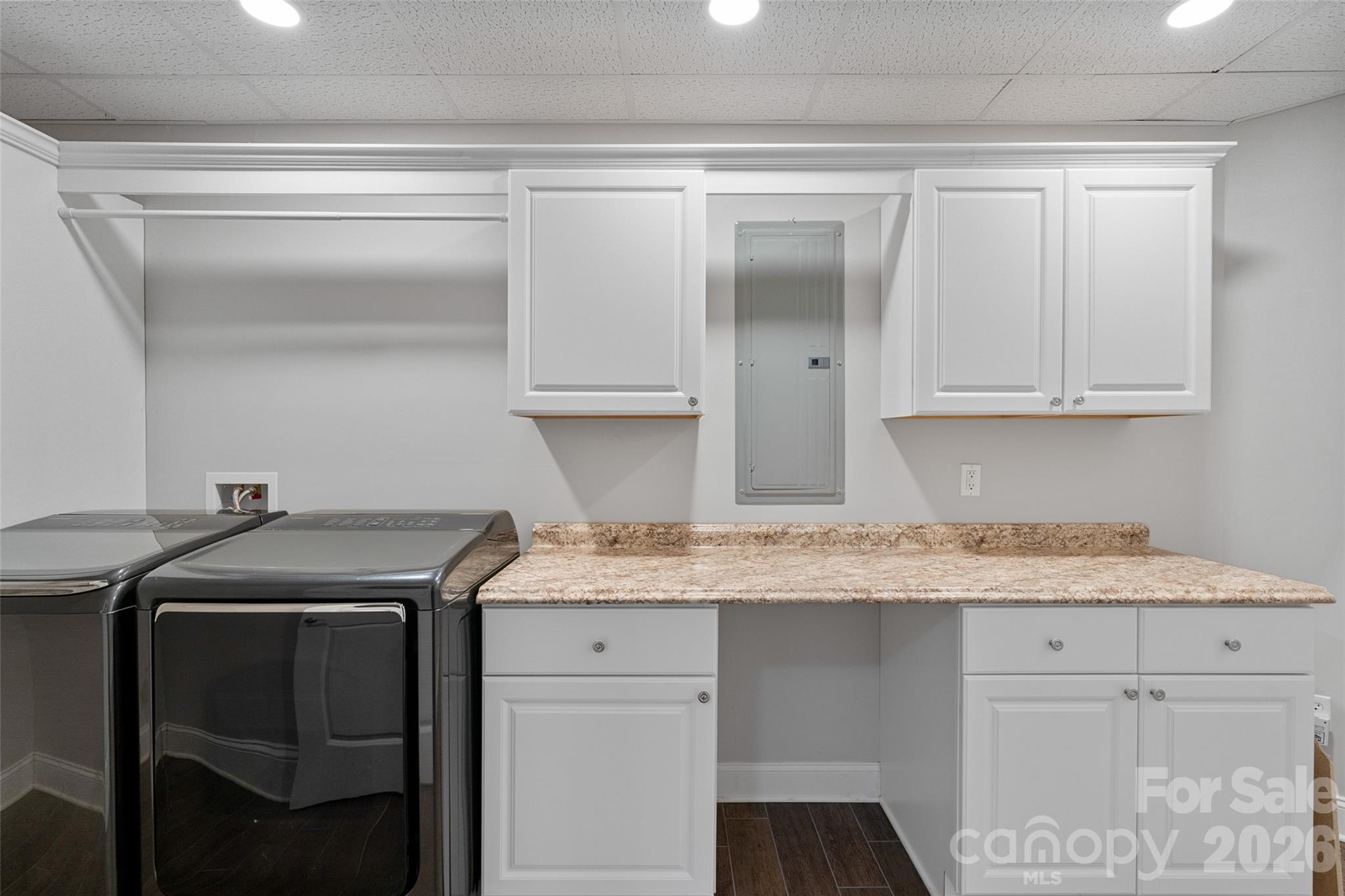 160 Fairway Falls Road Mills River, NC 28759 - Photo 38 of 43 a utility room with granite countertop cabinets washer and dryer