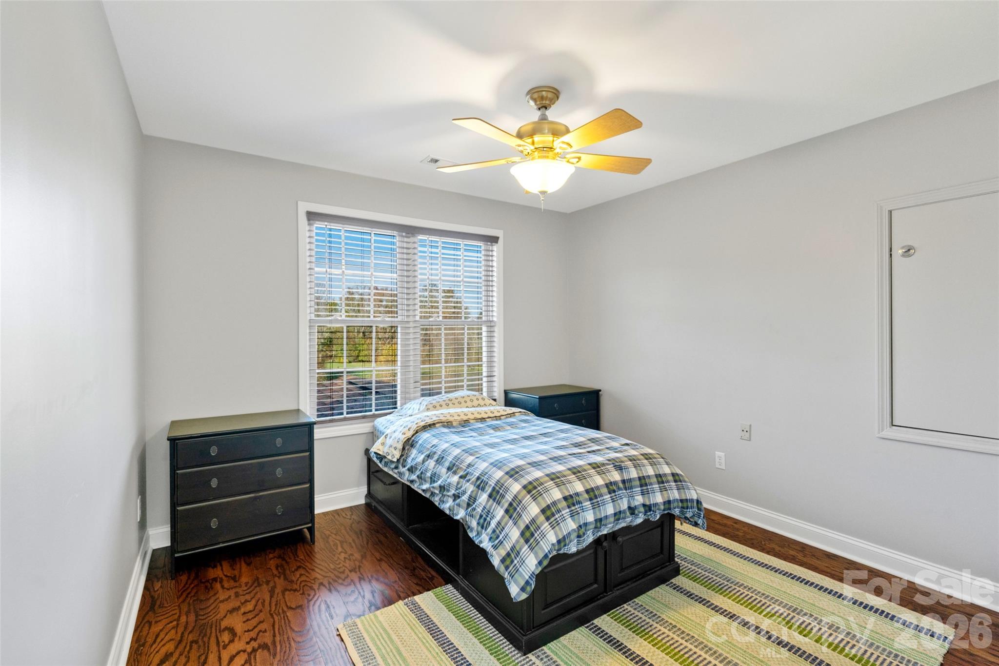 160 Fairway Falls Road Mills River, NC 28759 - Photo 42 of 43 a bedroom with a bed and a chandelier