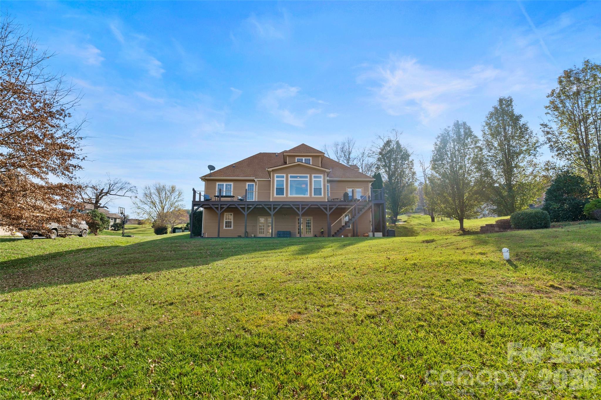 160 Fairway Falls Road Mills River, NC 28759 - Photo 10 of 43 a view of a big house with a big yard and large trees