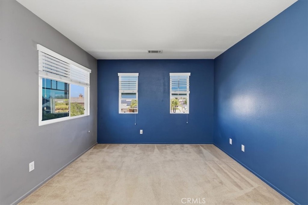 31249 Palomar Road Menifee, CA 92584 - Photo 9 of 21 Large Bedroom with walk-in closet and 3 windows