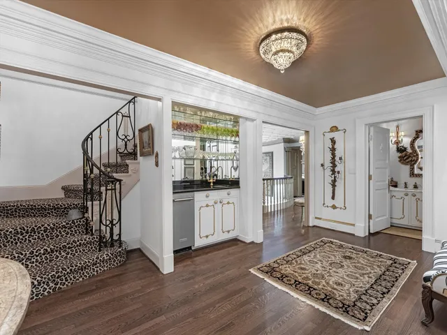 a view of an entryway with wooden floor