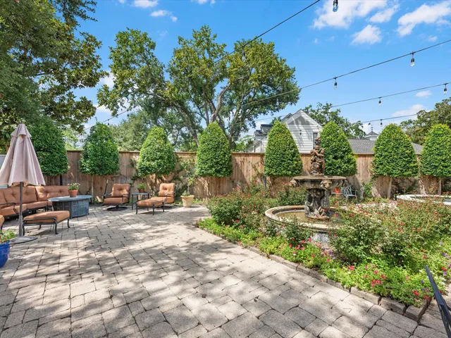 a view of backyard with sitting area