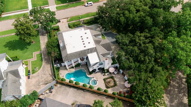 an aerial view of house with yard swimming pool and outdoor seating