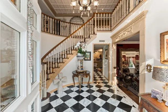 a view of entryway and hall with a front door