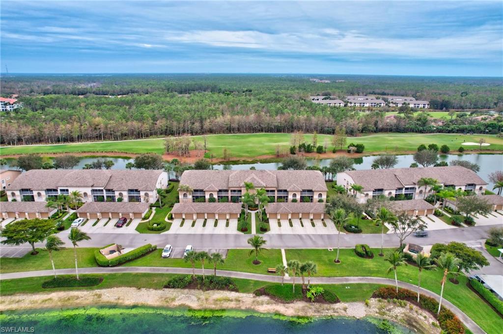 8630 Cedar Hammock Circle, Unit 1012 Naples, FL 34112 - Photo 30 of 37 a view of a city with lawn chairs