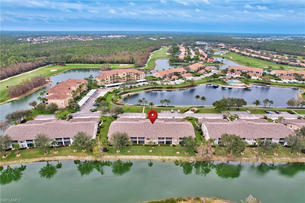 8630 Cedar Hammock Circle, Unit 1012 Naples, FL 34112 - Photo 33 of 37 an aerial view of residential houses with outdoor space