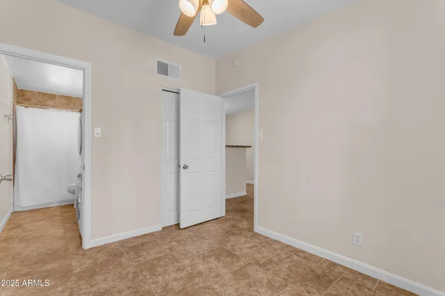 a view of a storage & utility room with a washer dryer