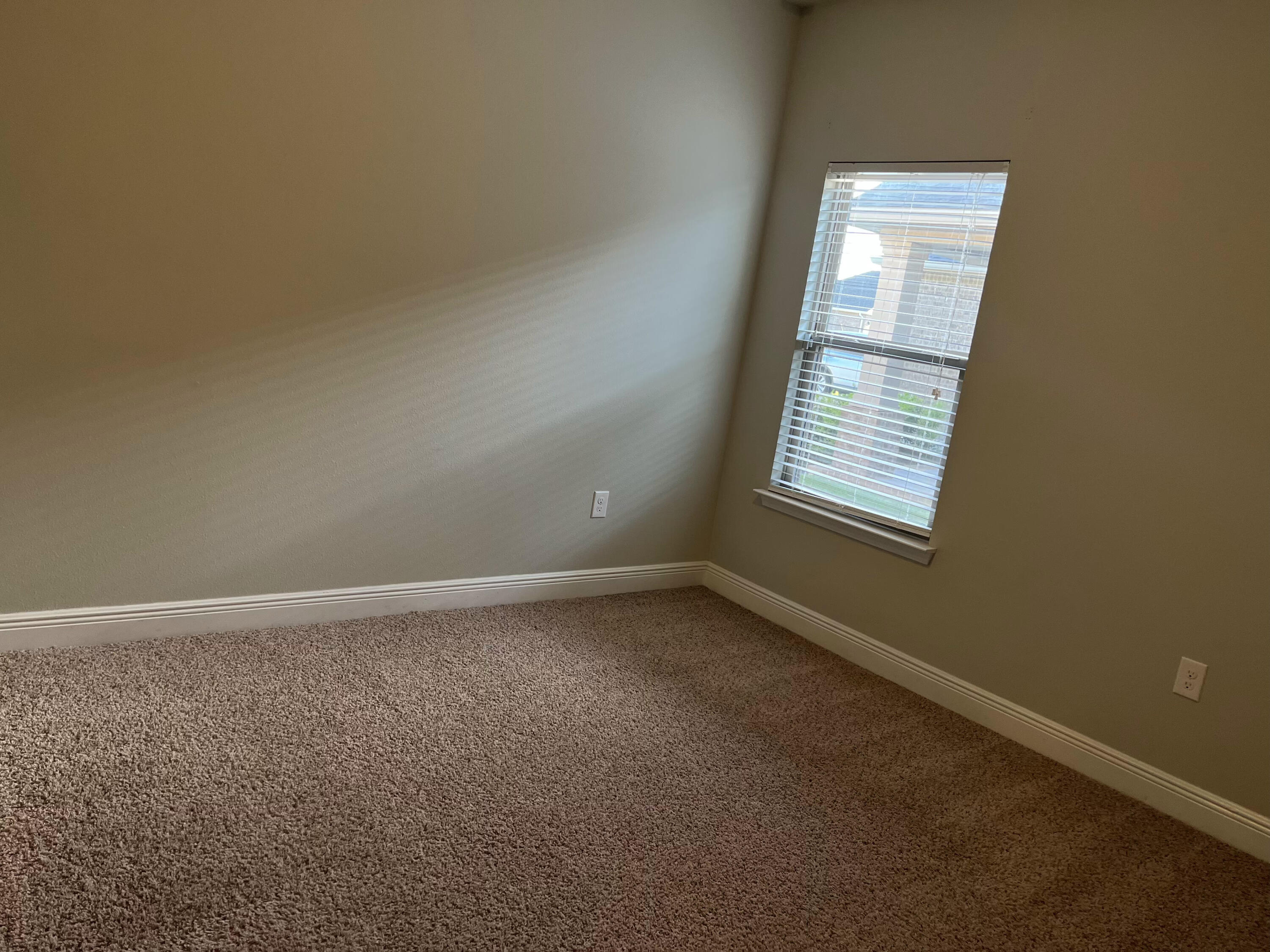 671 Teal Street Crestview, FL 32539 - Photo 11 of 22 an empty room with a window