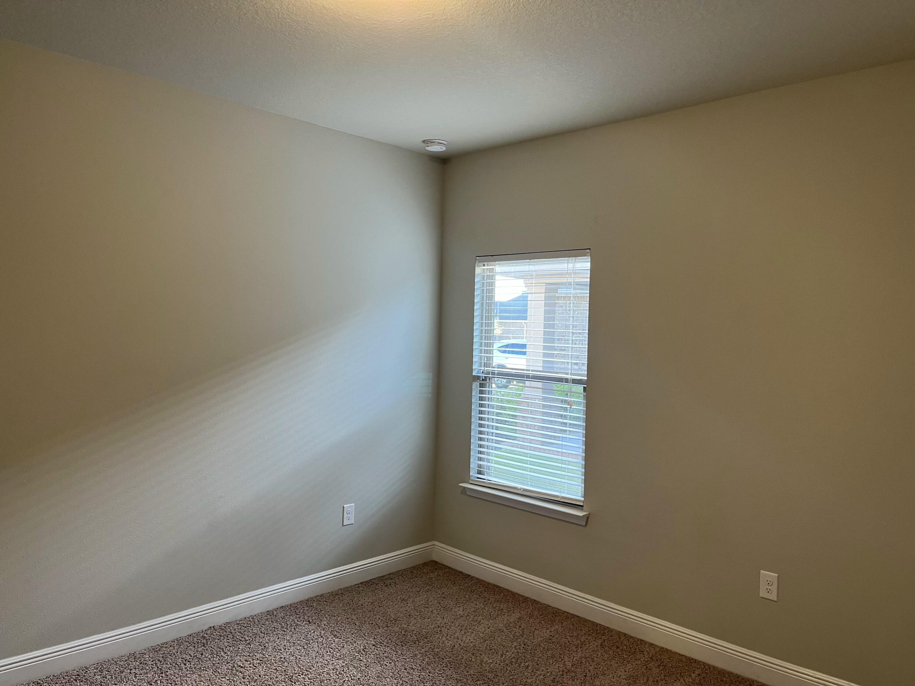 671 Teal Street Crestview, FL 32539 - Photo 12 of 22 an empty room with windows