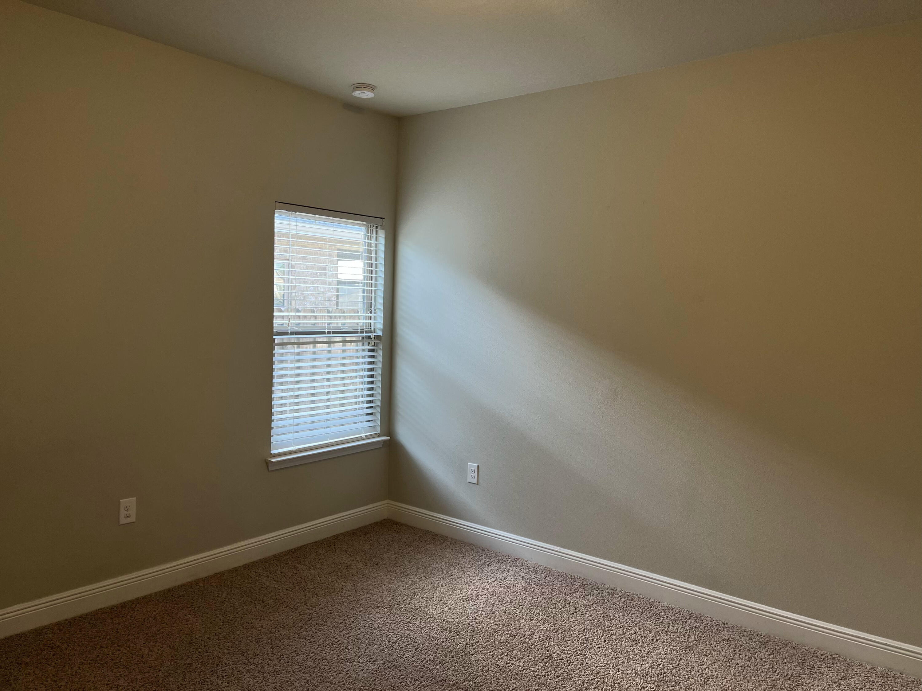 671 Teal Street Crestview, FL 32539 - Photo 13 of 22 an empty room with a window