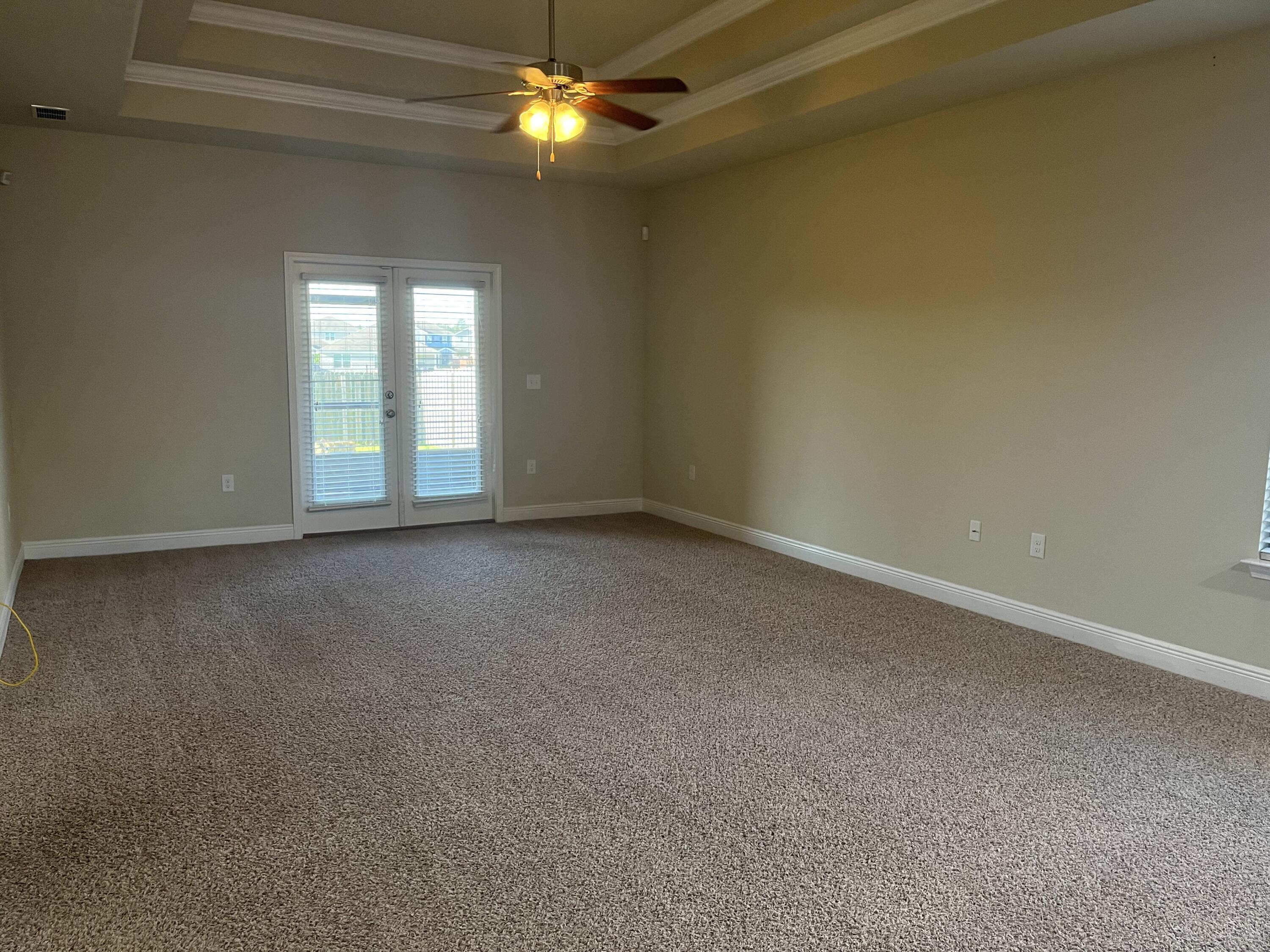 671 Teal Street Crestview, FL 32539 - Photo 6 of 22 a view of an empty room with a window