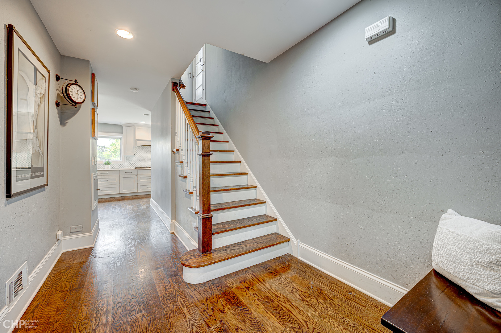 359 Blythe Road Riverside, IL 60546 - Photo 8 of 33 a view of a hallway with wooden floor and stairs