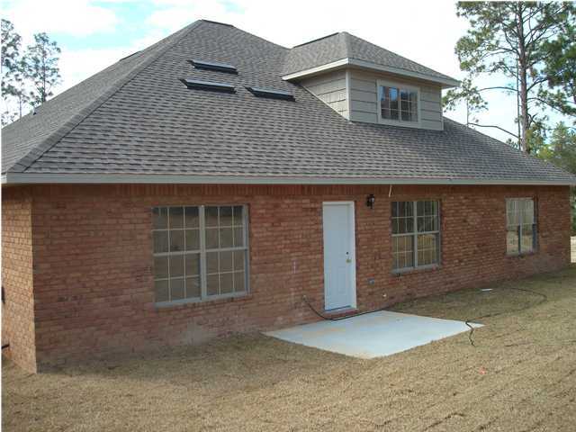 4620 Hermosa Road Crestview, FL 32539 - Photo 4 of 4 a front view of a house with a yard and garage