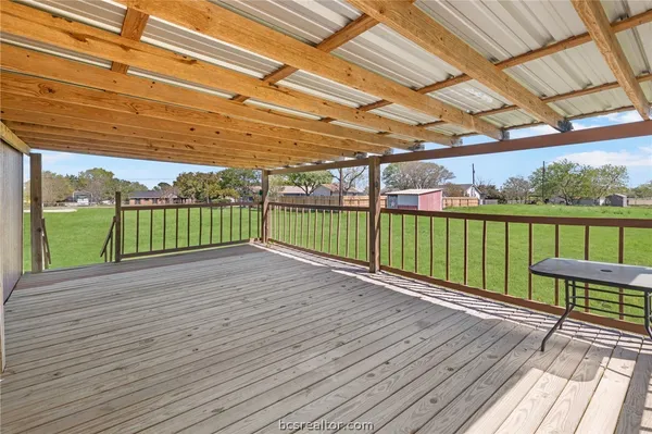 a view of a deck with wooden floor