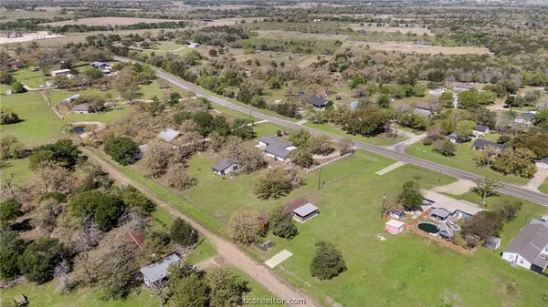 view of a forest with a yard