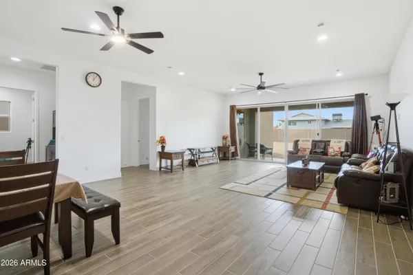 a living room with furniture and kitchen view
