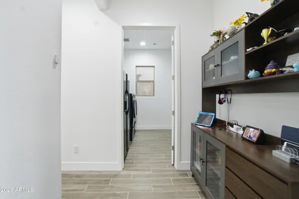 a bedroom with a bed and a ceiling fan