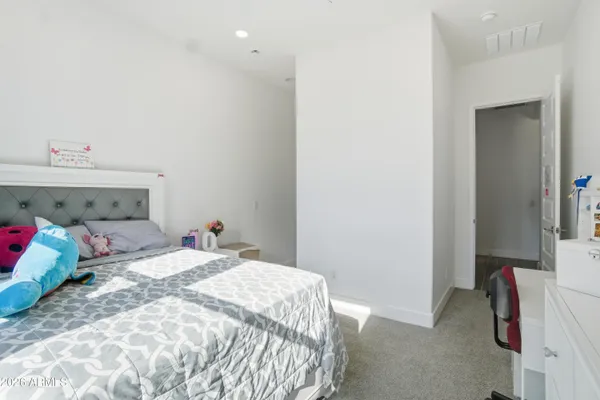 a view of a closet and a mirror