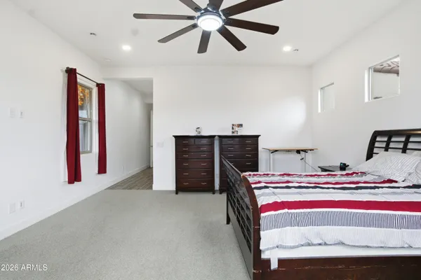 a view of a house with swimming pool and a yard