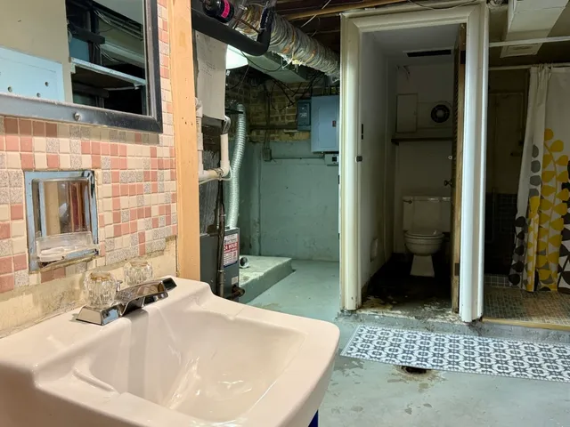 a bathroom with a sink and a shower