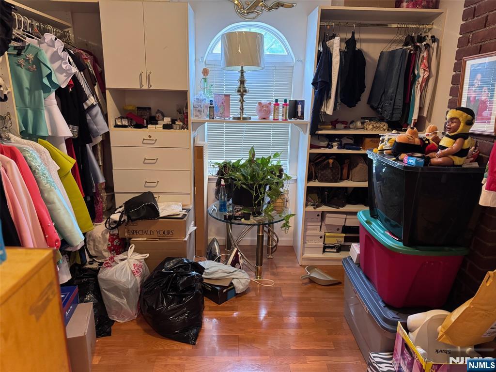 266 Hamilton Road Teaneck, NJ 07666 - Photo 12 of 27 a view of walk in closet with clothes and shoes