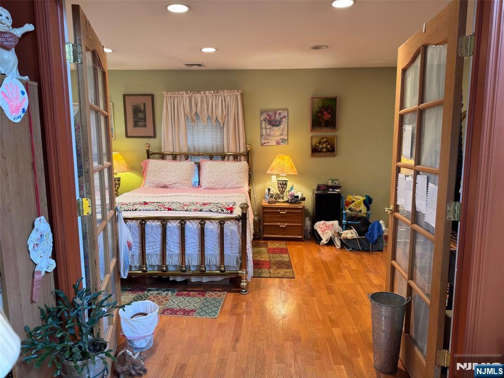 266 Hamilton Road Teaneck, NJ 07666 - Photo 26 of 27 a bedroom with furniture and a flat screen tv