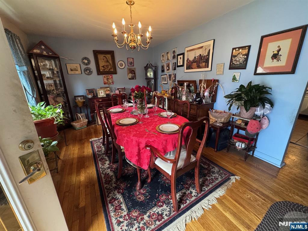 266 Hamilton Road Teaneck, NJ 07666 - Photo 4 of 27 a view of a dining room with furniture and chandelier