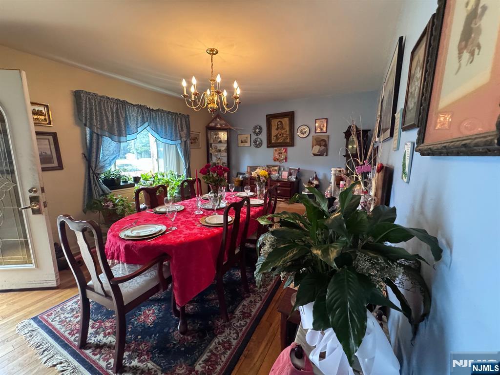 266 Hamilton Road Teaneck, NJ 07666 - Photo 5 of 27 a view of a dining room with furniture and chandelier