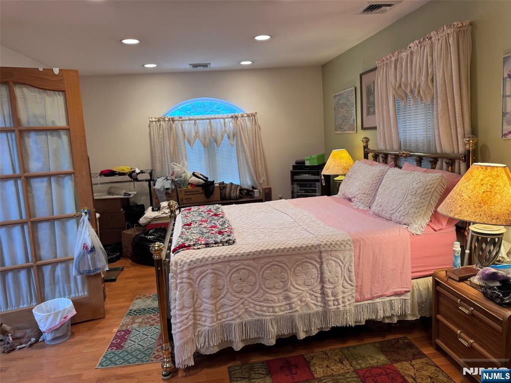 266 Hamilton Road Teaneck, NJ 07666 - Photo 10 of 27 a bedroom with a bed a dresser and book shelf