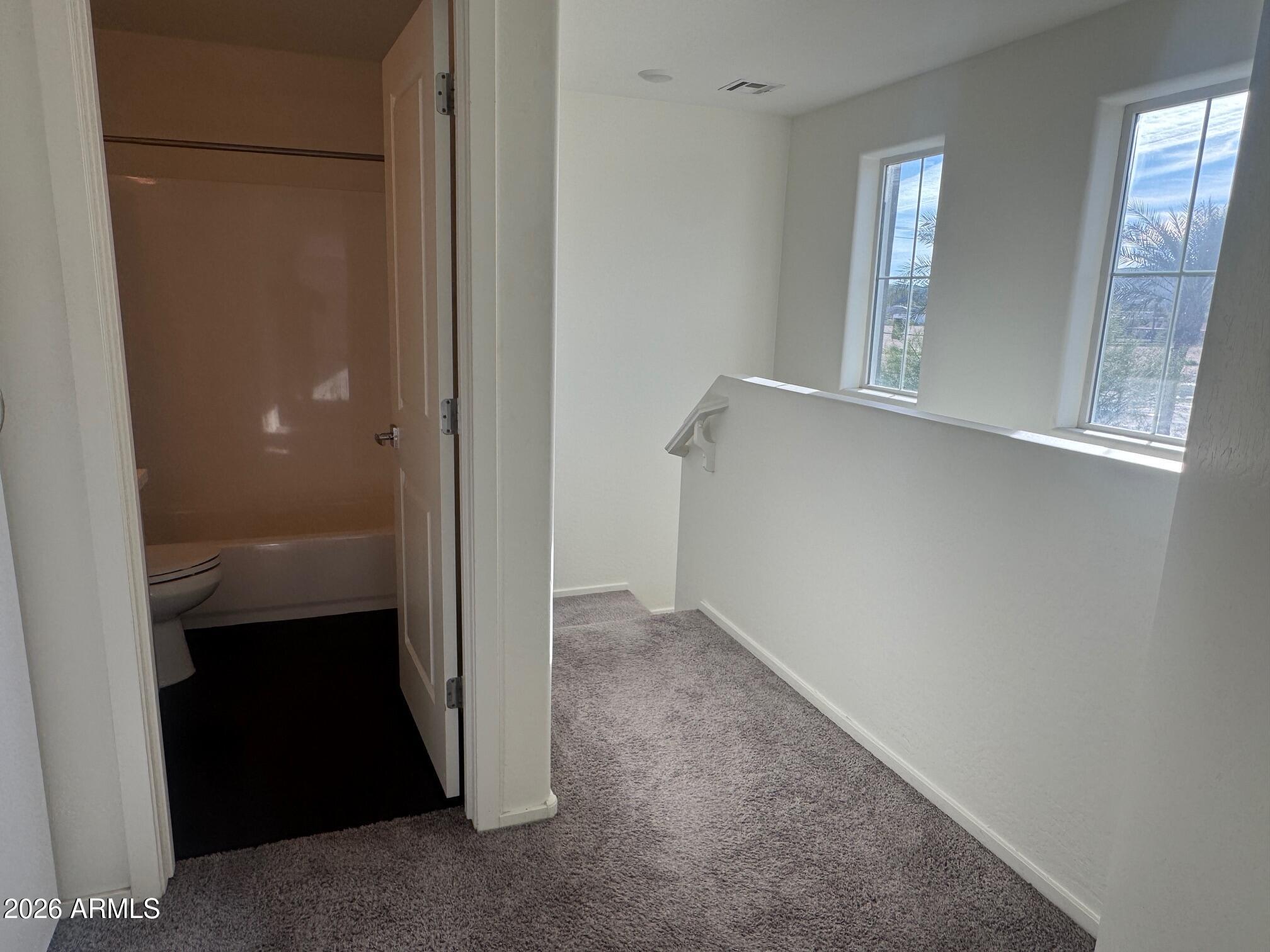 5851 South 23rd Way Phoenix, AZ 85040 - Photo 11 of 24 an empty room with windows